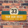 Van-den-Berg-naambord-koenmeloen-geel-blauw-wit-zwart muur rallybord