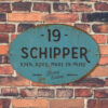 Naambord-Schipper-vintage-koenmeloen-voordeur-blauw-zwart-muur