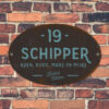 Naambord-Schipper-vintage-koenmeloen-voordeur-blauw-zwart-muur