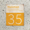 Naambord-Huisman-22-vlakken-nummer-onder-Koenmeloen--geel-wit-muur